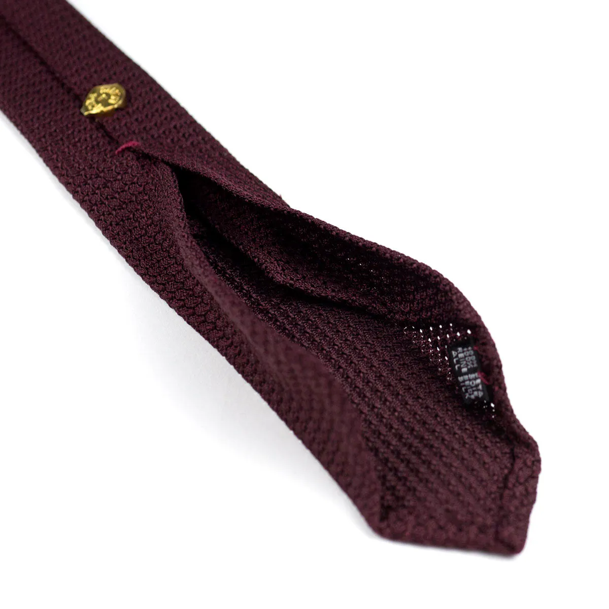 Seven-fold solid burgundy grenadine silk tie, handrolled edges