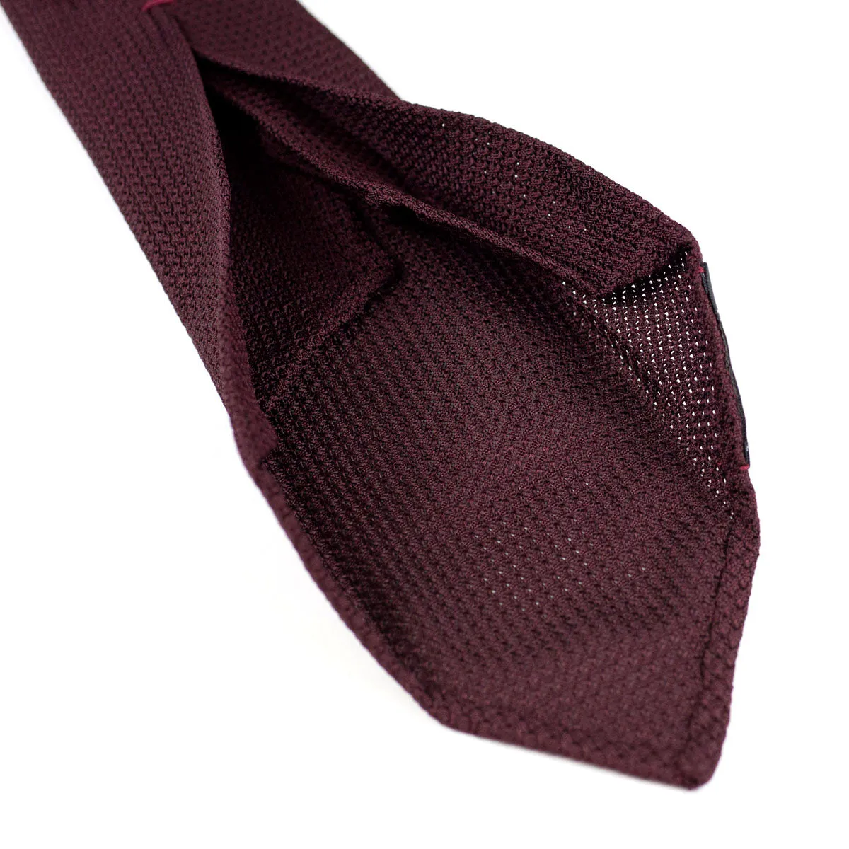 Seven-fold solid burgundy grenadine silk tie, handrolled edges